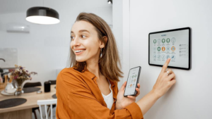 Woman Controlling Smart Thermostat